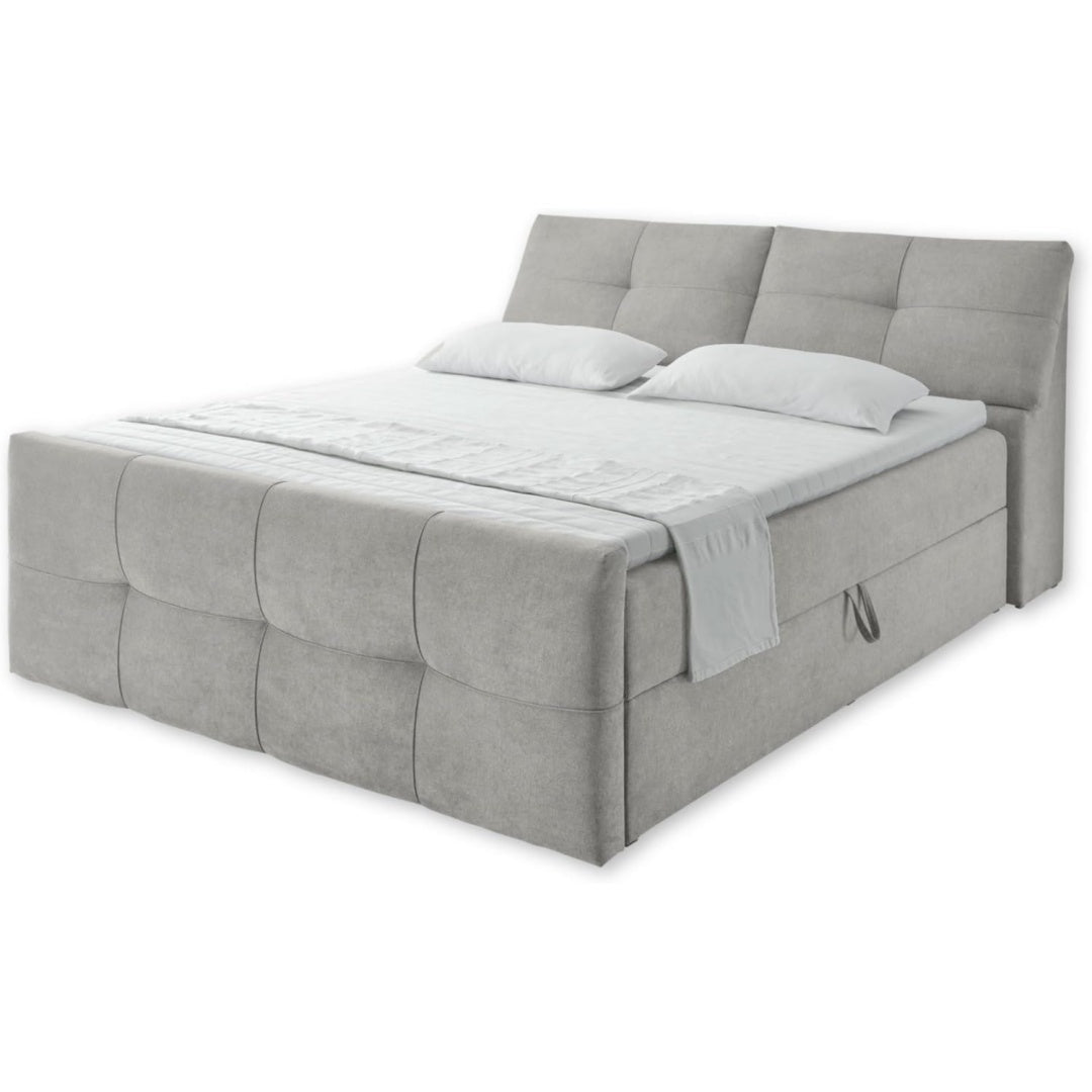Das Bettgestell zeigt einen Bettkasten in Taupe