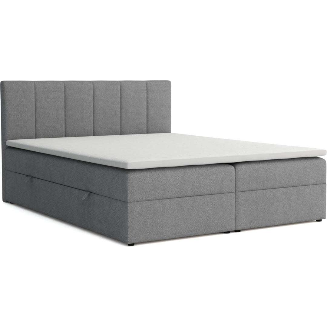 Weiche Polster treffen auf einen Bettkasten an dem Boxspringbett